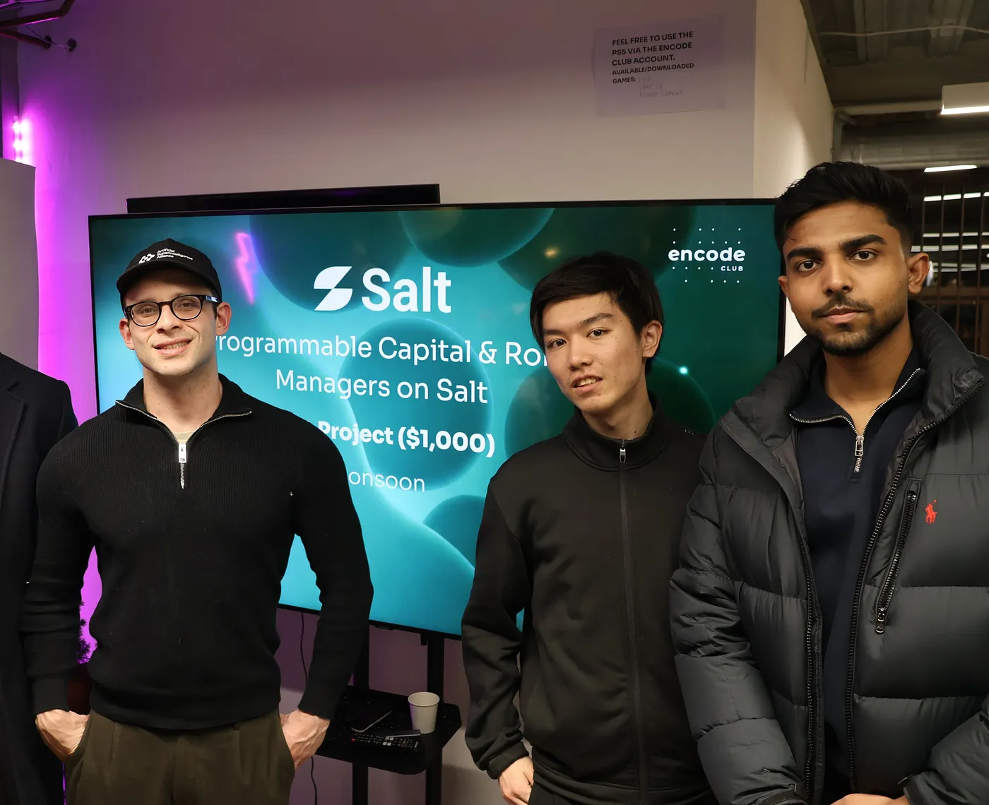 The three-person Monsoon team standing in front of a screen showing the Salt bounty slide